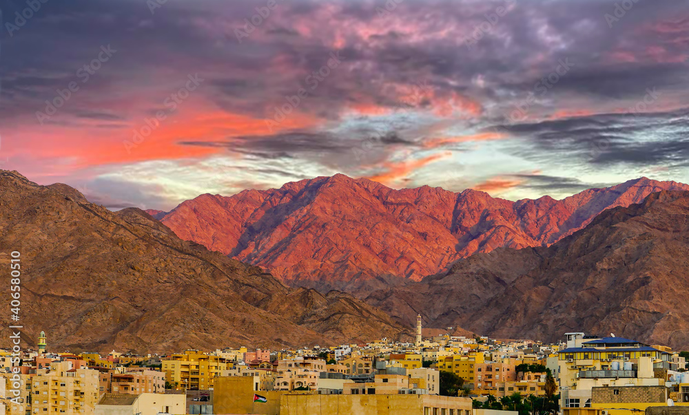 Jordan, city of Aqaba, beautiful sunset over the city and mountains.