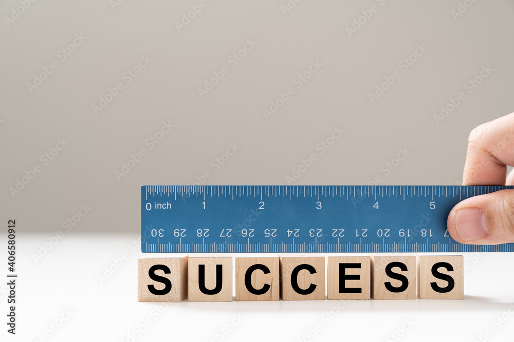 © Kenishirotie - Measure success word using blue ruler, representing a review, evaluation or assessment of an employee © Kenishirotie - Measure success word using blue ruler, representing a review, evaluation or assessment of an employee