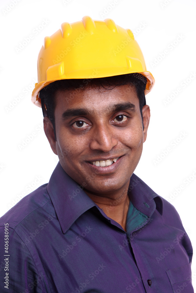 Young Indian architect posing to the camera on white background. Young Indian architect posing to the camera on white background.