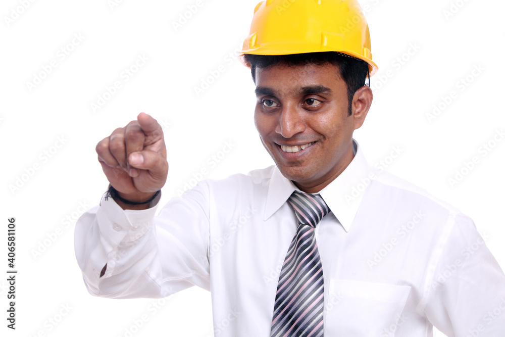 Young Indian architect pointing to the camera on white background. Young Indian architect pointing to the camera on white background.