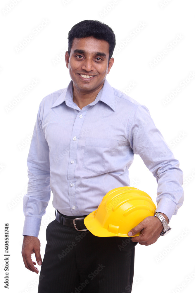 Young Indian architect posing to the camera on white background. Young Indian architect posing to the camera on white background.