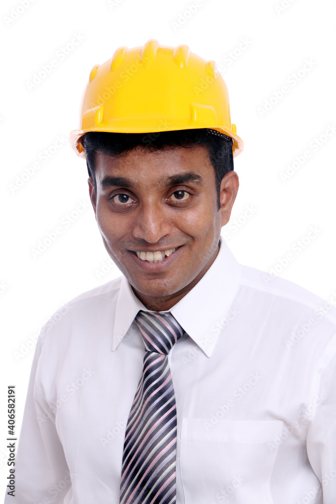 Young Indian architect posing to the camera on white background. Young Indian architect posing to the camera on white background.