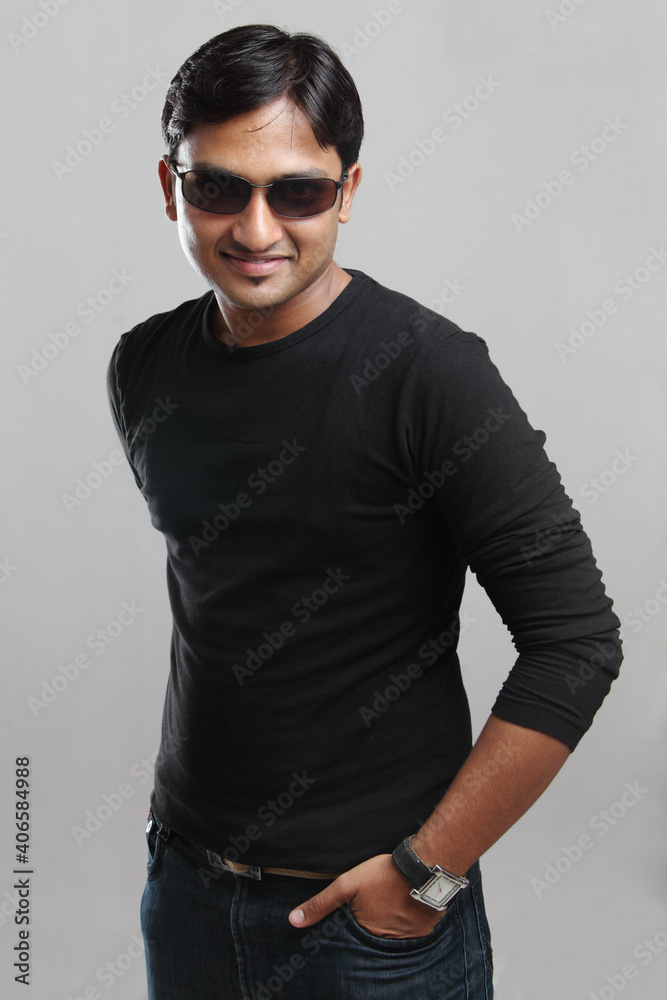 Indian young man posing in casual dress on white. Indian young man posing in casual dress on white.