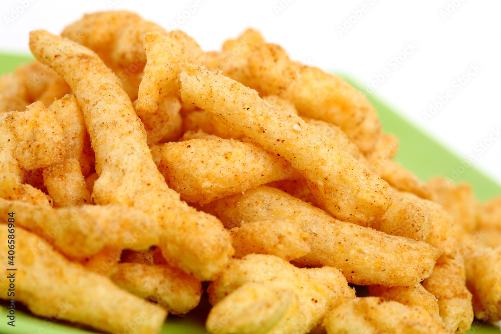 Cheese curls isolated on a white background Cheese curls isolated on a white background