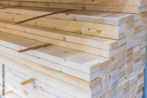 The texture of a wooden bar. Dry planed solid wood block. Construction industry. For construction and finishing works. Sale of building materials. 