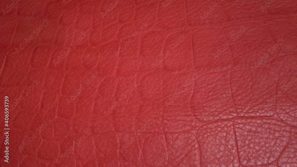 Red leather texture very close up. Natural pattern. Fashion and clothing industry, shoes, bag, belt, coat and other leather accessories, Leather Upholstery Furniture Red leather texture very close up. Natural pattern. Fashion and clothing industry, shoes, bag, belt, coat and other leather accessories, Leather Upholstery Furniture