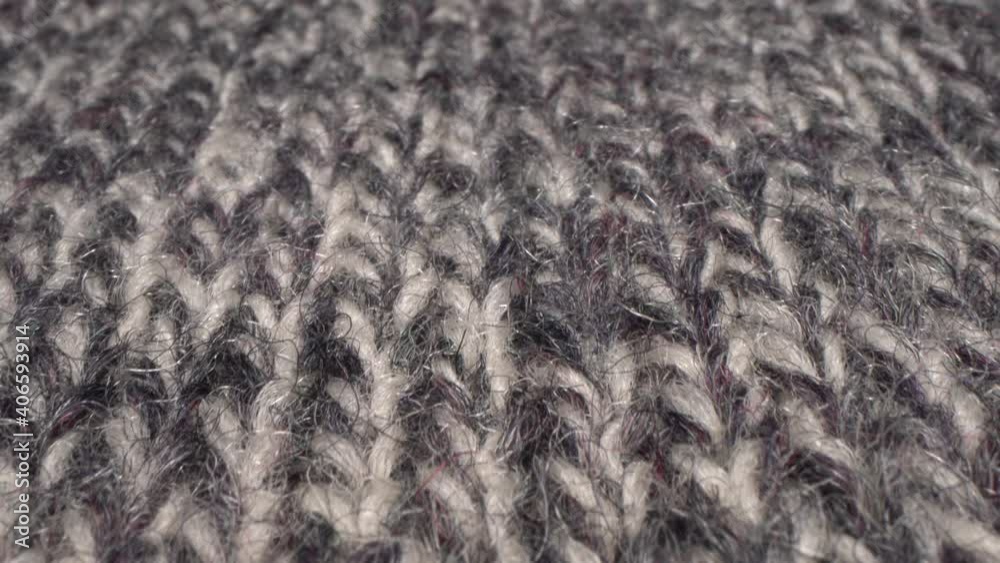 Cozy sheep wool fabric texture in macro. Handcraft knitting woolen sweater. Soft textile abstract background. Winter fashion clothing industry. Home comfort and cosiness Cozy sheep wool fabric texture in macro. Handcraft knitting woolen sweater. Soft textile abstract background. Winter fashion clothing industry. Home comfort and cosiness