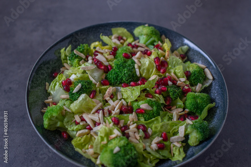 healthy tasty Broccoli salad with pomegranate on a table