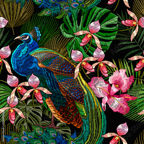 Embroidery peacocks and orchid exotic tropical flowers. seamless pattern. Fashionable template for design of clothes. Fashion tropical birds. Jungle forest art