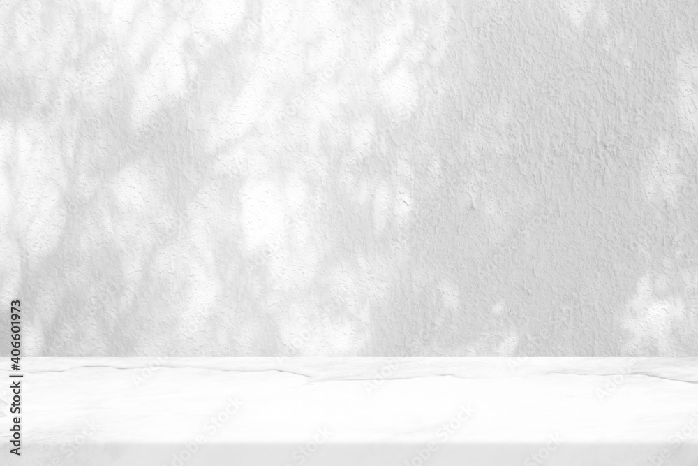 Fototapeta premium White Marble Table with Tree Shadow on Stucco Wall Texture Background, Suitable for Product Presentation Backdrop, Display, and Mock up.
