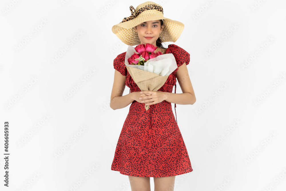 Love and romance on Valentines day. Beauty young Asian woman in red dress holding bouquet of roses over white isolated background. Love and romance on Valentines day. Beauty young Asian woman in red dress holding bouquet of roses over white isolated background.