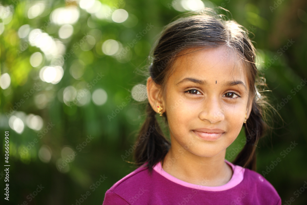 Indian beautiful teen girl posing to camera with smile