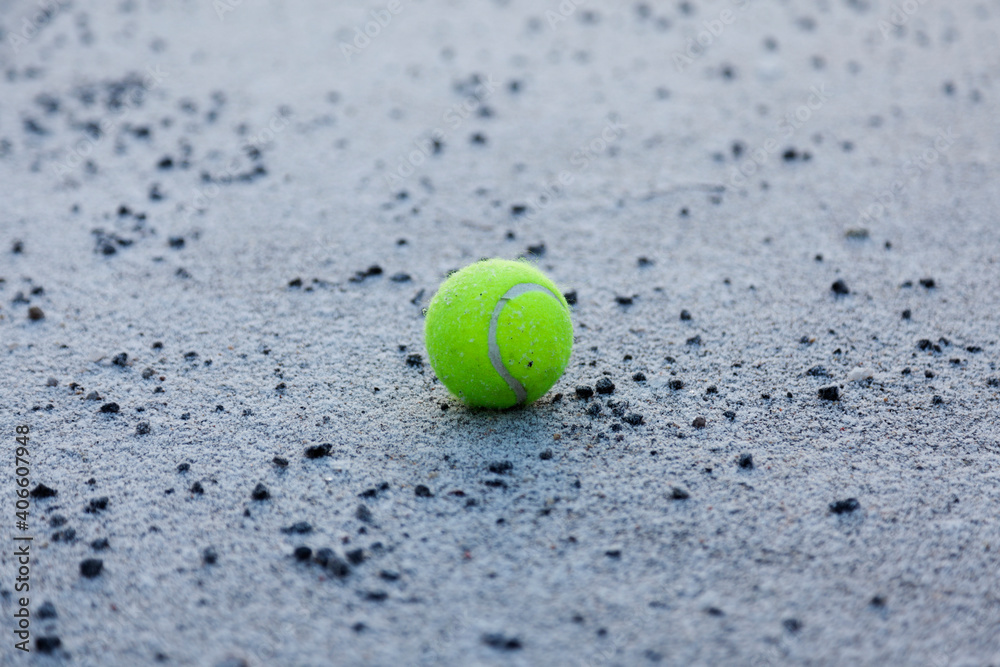 abandoned tennis ball in schoolyard