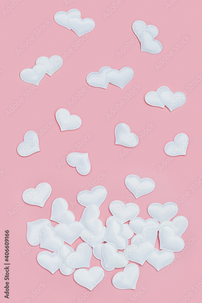 Valentines Day background with white hearts on pink colored. Greeting card or invitation for wedding cards. Pastel colors.