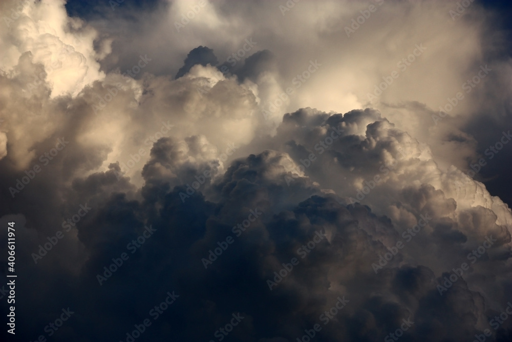 Evening summer sky. Fragment of very big cumulus cloud. Improbable form and mixture of paints.