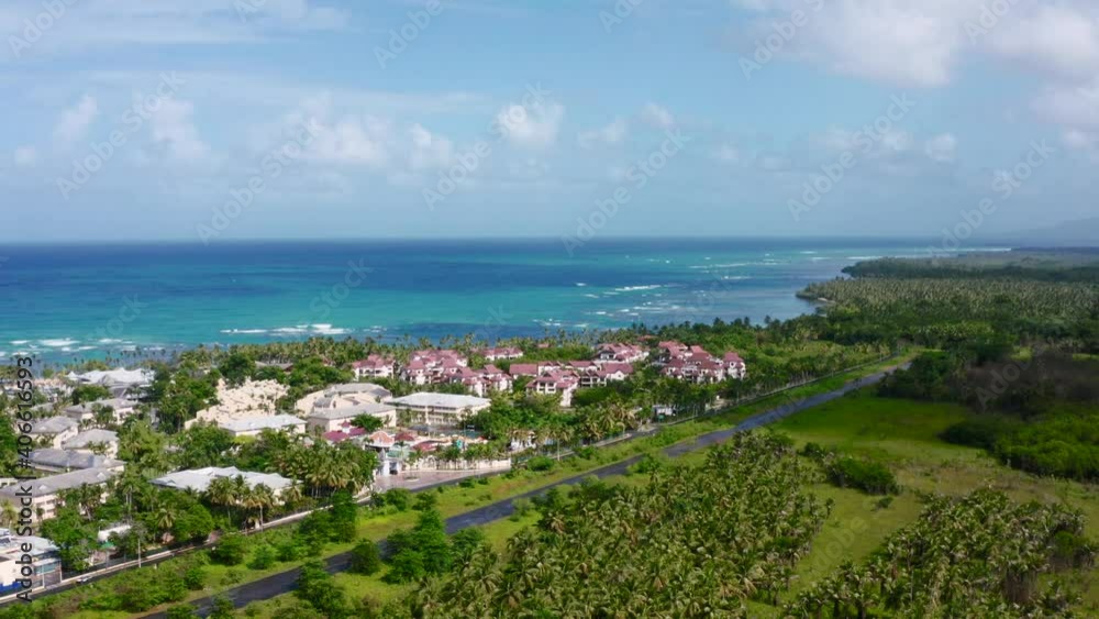 Aerial view of tropical beach.Sea waves and shoreline, sunny day. Drone landscape panning shot,Grand Bahia beach,El Portillo, Samana peninsula,Dominican Republic , Hotel residence portillo Aerial view of tropical beach.Sea waves and shoreline, sunny day. Drone landscape panning shot,Grand Bahia beach,El Portillo, Samana peninsula,Dominican Republic , Hotel residence portillo