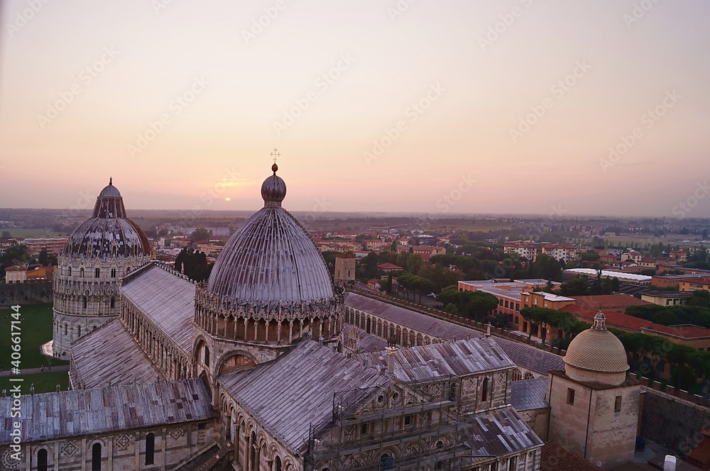 View of the cathedral and baptistery of Pisa from the leaning tower at sunset, Tuscany, Italy
