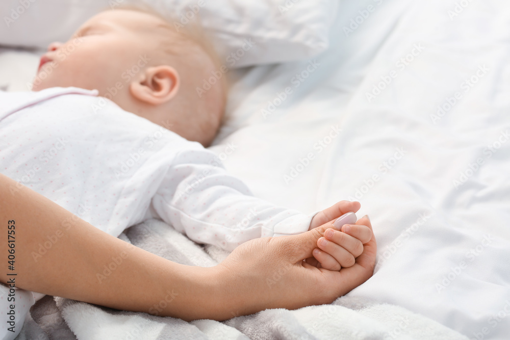 Mother with little baby sleeping on bed Mother with little baby sleeping on bed