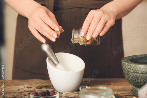 Female alchemist making eli...