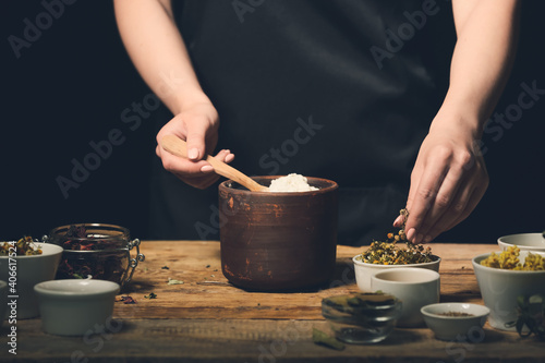 Female alchemist making eli...