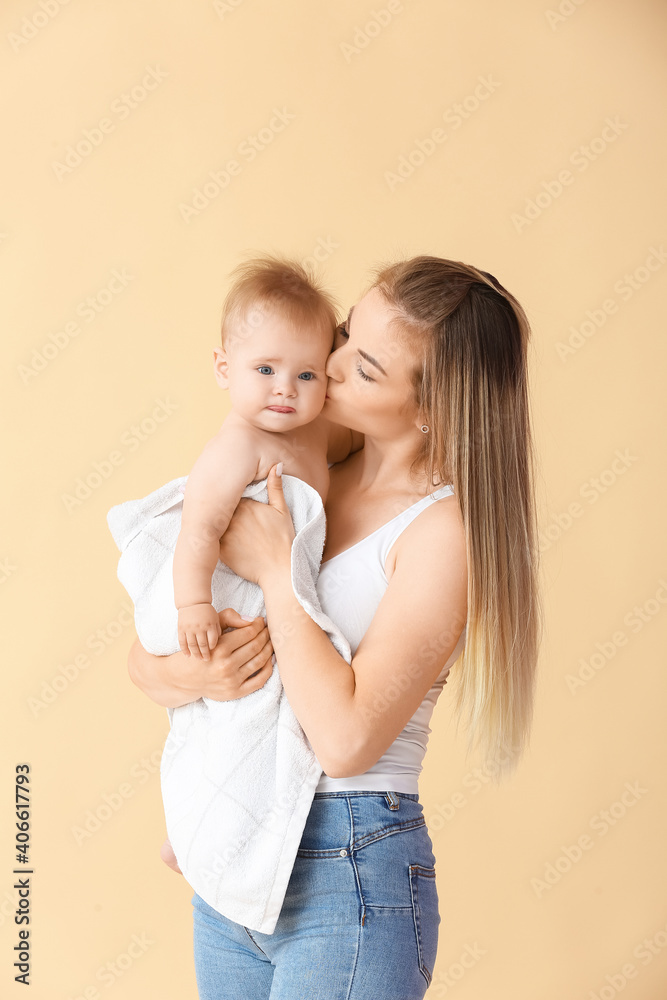 Happy mother with cute little baby on color background Happy mother with cute little baby on color background
