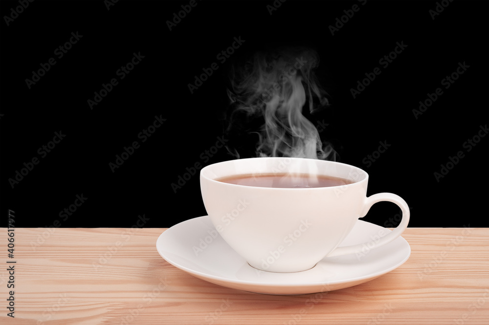 white cup with hot tea on wooden table isolated on black background. side view. steam from a hot drink. copy space white cup with hot tea on wooden table isolated on black background. side view. steam from a hot drink. copy space