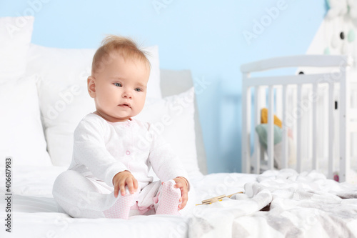 Adorable baby girl sitting ...