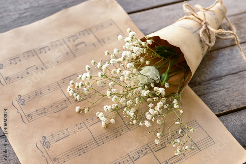 Music sheets and flowers on...