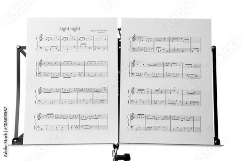 Bild auf Leinwand Note stand with music sheets on white background