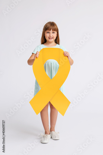 Little girl with golden rib...