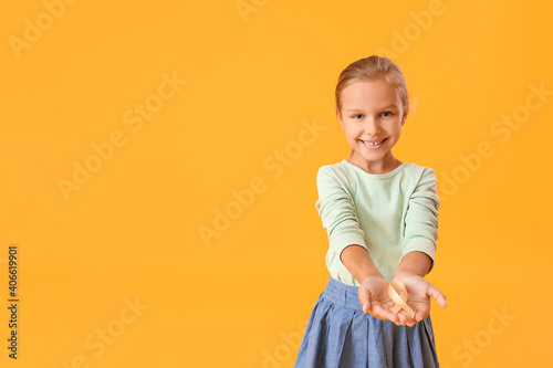 Little girl with golden rib...