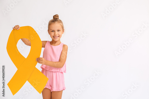 Little girl with golden rib...