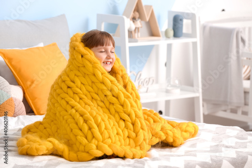 Happy little girl with warm...