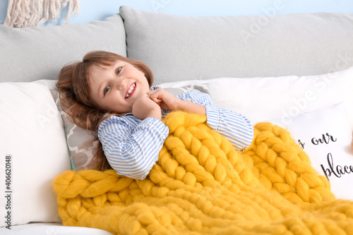 Happy little girl with warm...