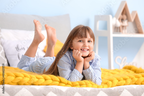 Happy little girl with warm...
