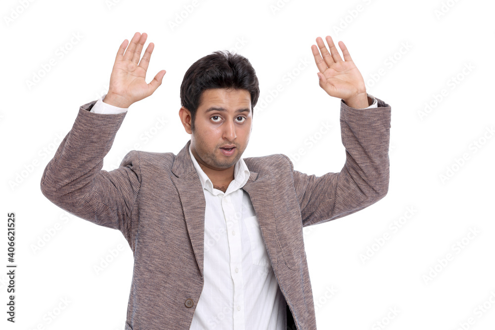 Happy young Indian businessman dancing on white.
Happy young Indian businessman dancing on white.