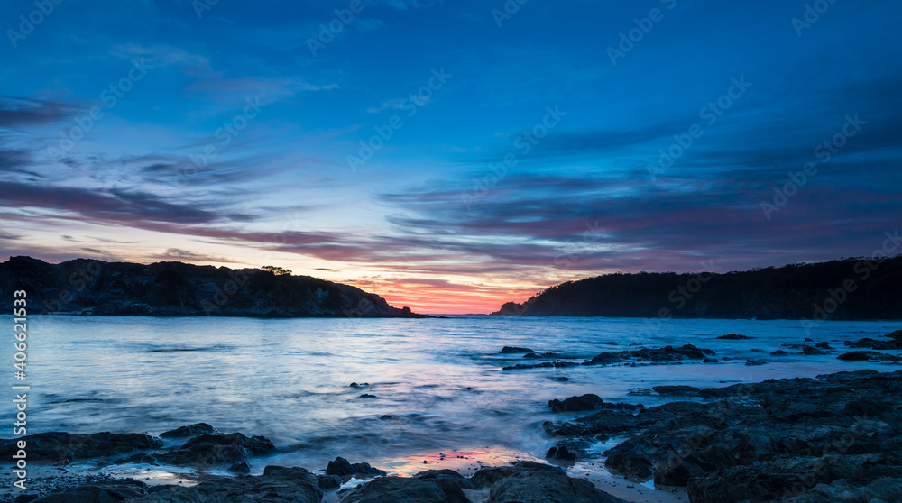 Colourful High Cloud Sunrise Seascape Panorama and Rock Formations