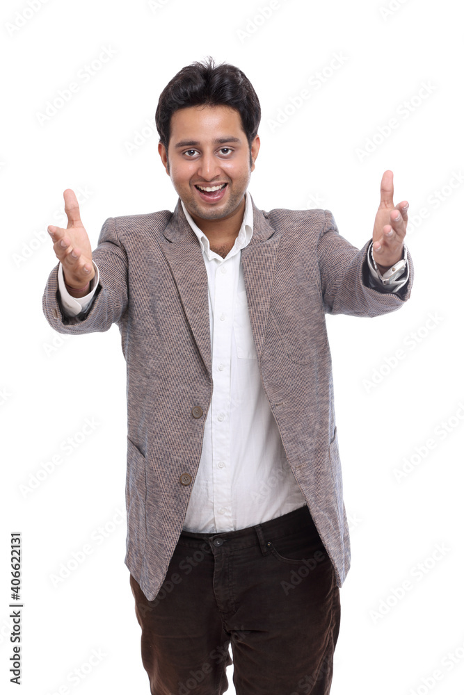 Happy young Indian businessman dancing on white.
Happy young Indian businessman dancing on white.