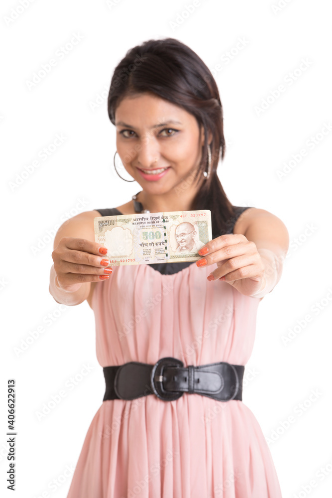 Happy young woman holding Indian 500 rupee notes on white. Happy young woman holding Indian 500 rupee notes on white.
