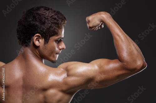 muscular man showing biceps