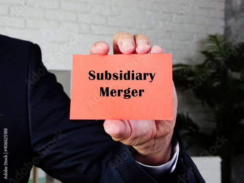  Financial concept meaning Subsidiary Merger with inscription on the sheet.