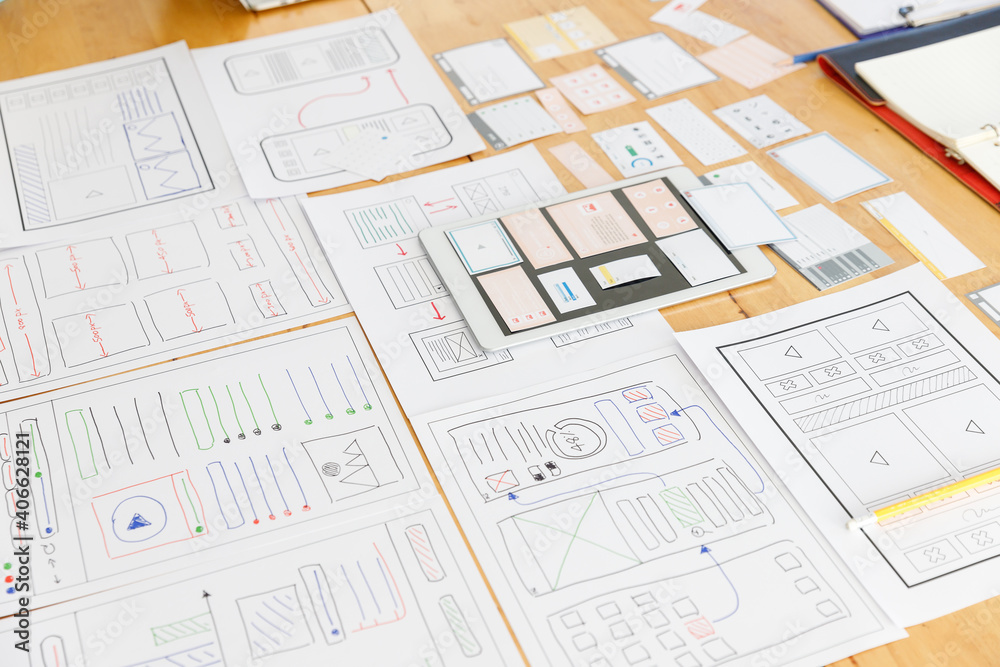 Graphic designers work together with UX UI designer planning application template layout framework for mobile phone computer mobile Graphic designers work together with UX UI designer planning application template layout framework for mobile phone computer mobile