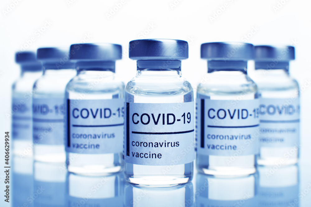 Glass sealed vials with coronavirus vaccine text on label Glass sealed vials with coronavirus vaccine text on label