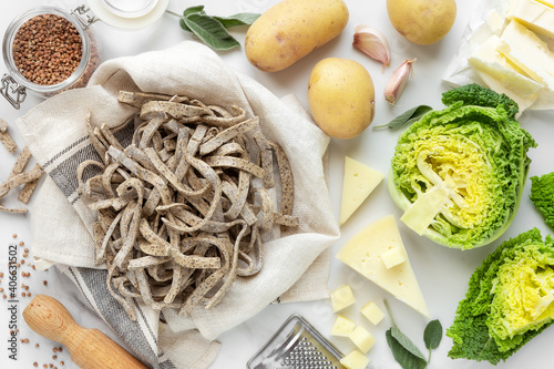 Pizzoccheri alla Valtellinese ingredients - buckwheat pasta, potatoes, cheese, cabbage and butter