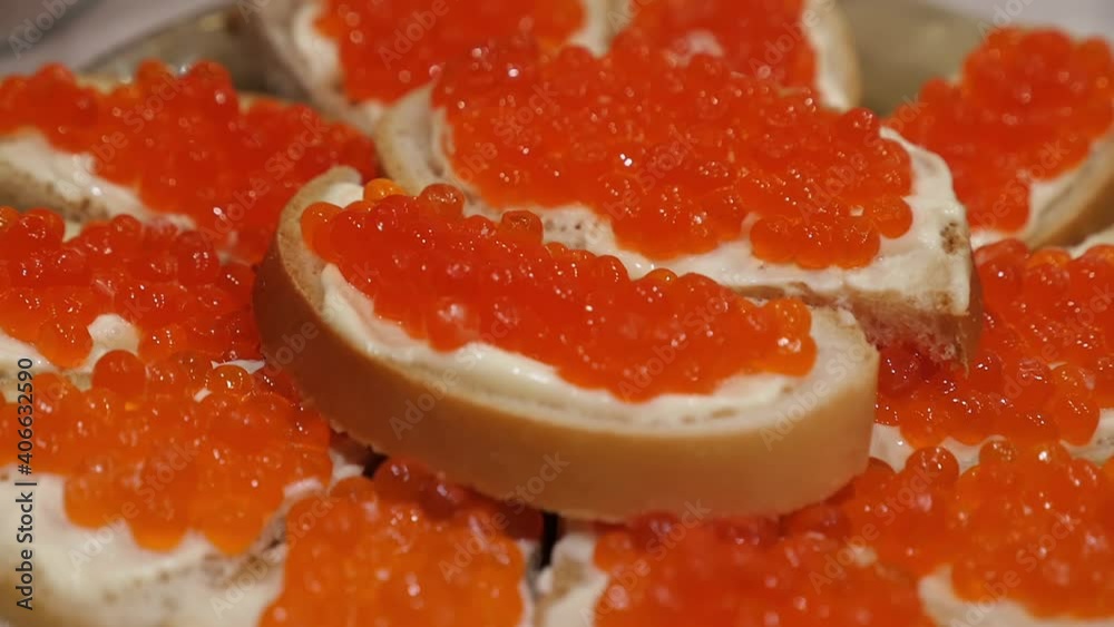 Sandwiches with butter and red caviar close-up Sandwiches with butter and red caviar close-up