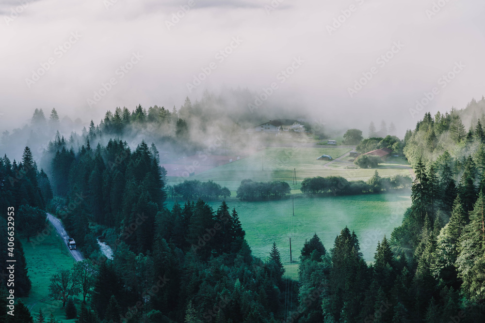 Heavy morning fog mist over road in Gaicht Austria Village in morning hour