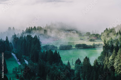 Heavy morning fog mist over road in Gaicht Austria Village in morning hour