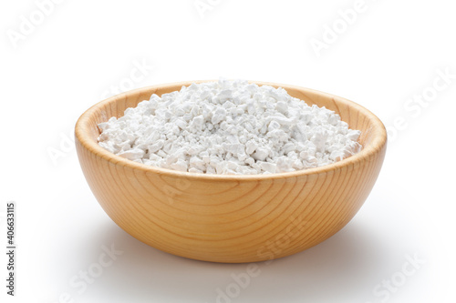 Sweet potato starch in a wooden bowl isolated on white background