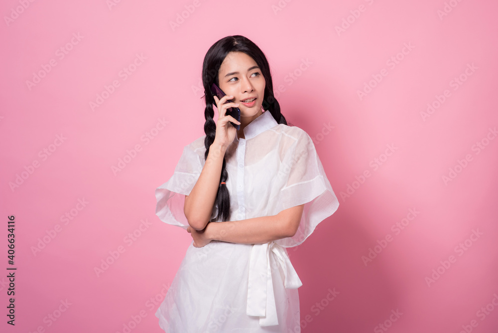 Happy cheerful young woman wearing her black hair rejoicing at positive news or birthday gift, looking at camera with joyful and charming smile. Asian girl portrait on pink background in studio Happy cheerful young woman wearing her black hair rejoicing at positive news or birthday gift, looking at camera with joyful and charming smile. Asian girl portrait on pink background in studio