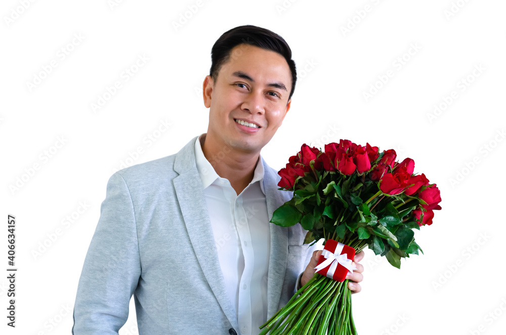 Asian man wearing grey suit holding a bouquet of red roses and red gift box isolated in white background for anniversary or Valentine's day concept. Asian man wearing grey suit holding a bouquet of red roses and red gift box isolated in white background for anniversary or Valentine's day concept.